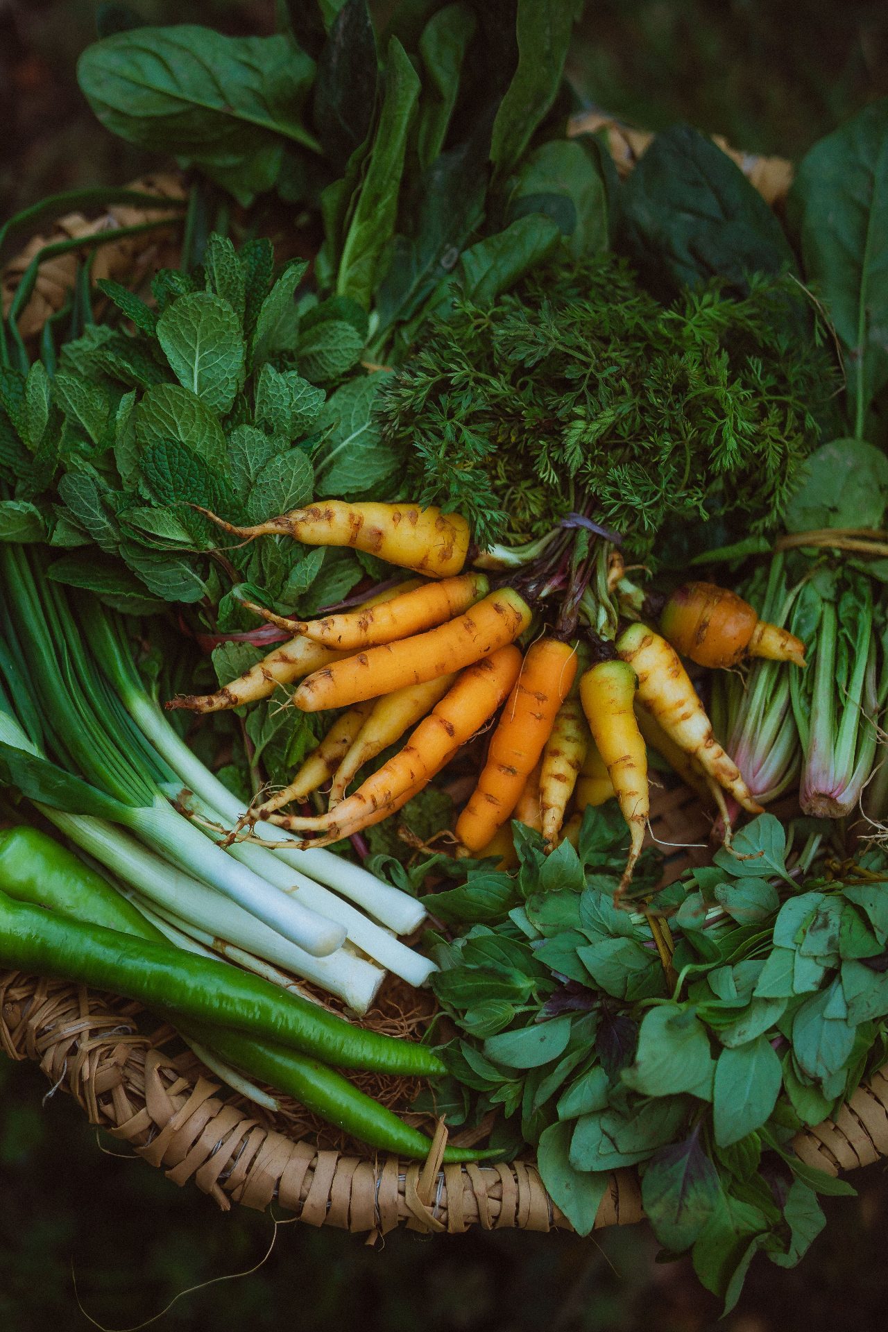 Fresh African market vegetables in a woven basket